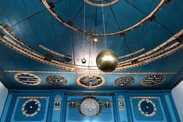 Eise Eisinga Planetarium blue ceiling with orrery, a Dutch heritage highlight on a private tour from The Hague