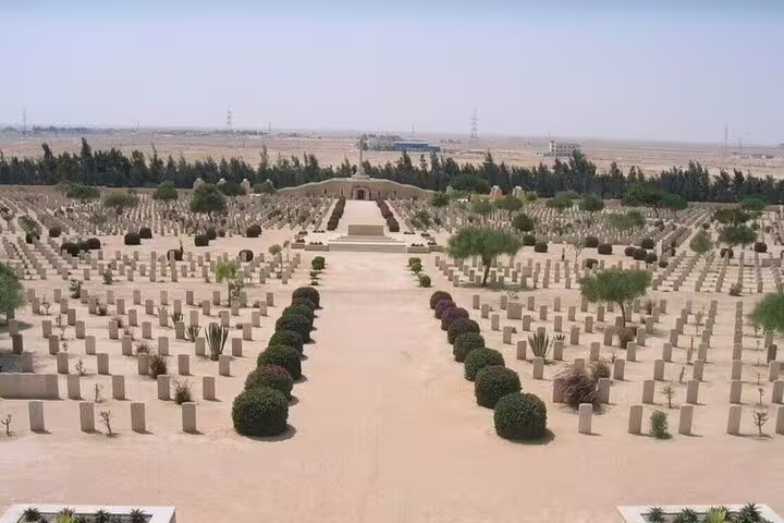 El Alamein WWII cemetery seen on private history tour from Alexandria, rows of graves in desert memorial