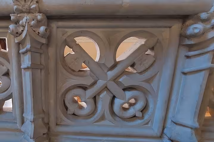 Intricate stone carving detail from the interior of El Capricho de Gaudi in Comillas, showcasing modernist design.