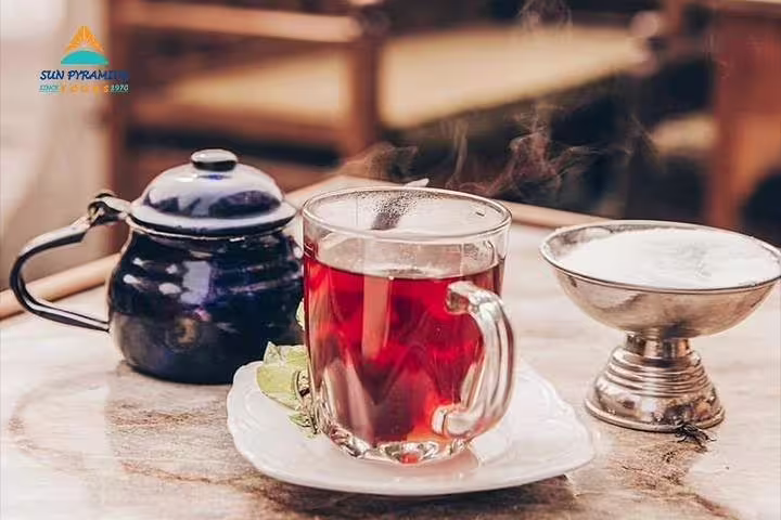 Hot mint tea and shisha setup on a table at El-Fishawy Café, Khan El Khalili, Cairo tour highlight