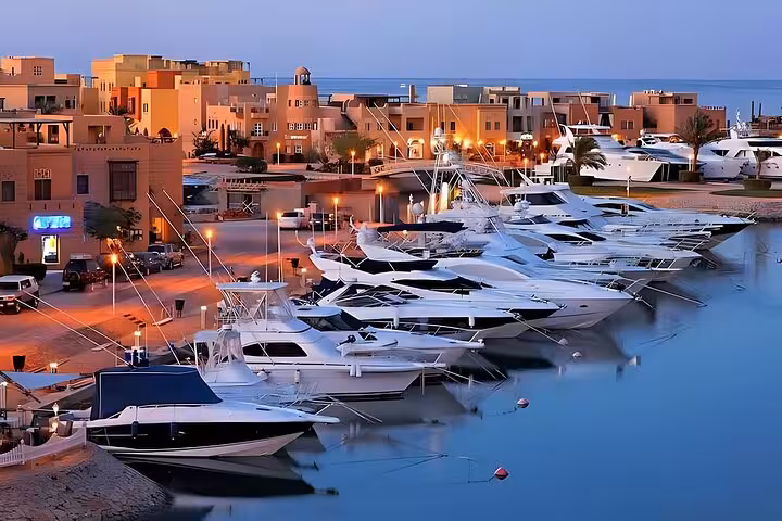 El Gouna Abu Tig Marina at sunset with luxury yachts, highlight of private city tour and lagoon cruise
