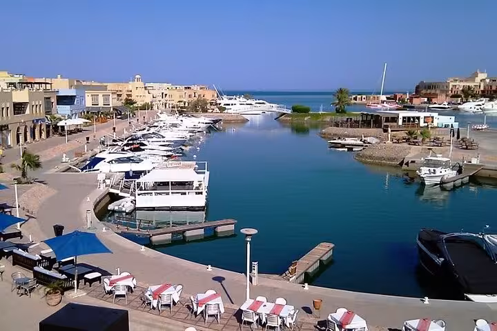 El Gouna Abu Tig Marina with yachts and waterfront cafes, featured on private city tour and lagoon cruise