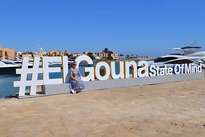 El Gouna marina sign by yachts on a private half-day city tour and lagoon cruise in Hurghada, Egypt
