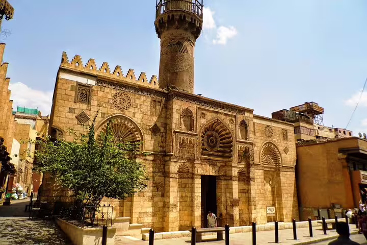 Historic mosque façade on El-Moez Street in Islamic Cairo, cultural walk before Cairo Tower and El-Fishawy Café