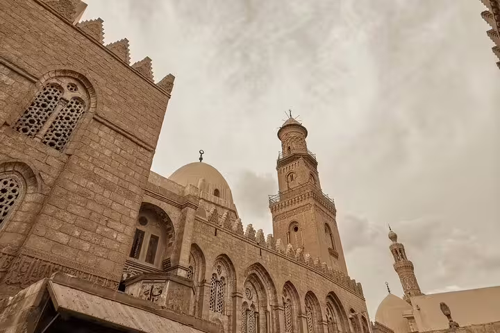 Historic mosque domes and minaret on El Moez Street, Cairo, featured on a 4-hour guided tour