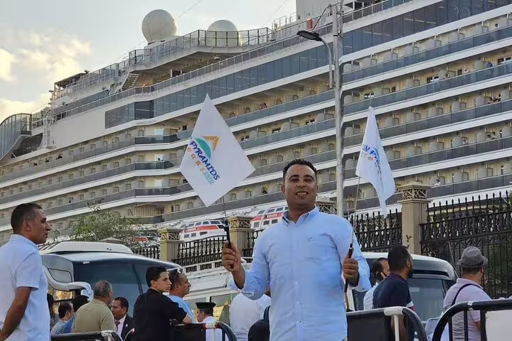 Tour representative greeting cruise guests at El Sokhna Port for a private Sakkara Pyramids desert safari excursion