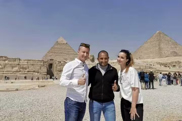 Private Sakkara Pyramids desert safari tour from El Sokhna Port with travelers and guide at Giza pyramids viewpoint