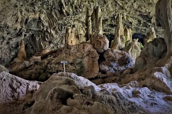 Explore the captivating rock formations inside a cave on the Elafonisi Beach private tour from Chania, Crete adventure.