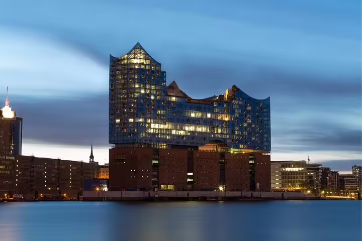 Elbphilharmonie Hamburg at dusk over the harbor, highlight for a self-guided scavenger hunt and walking tour