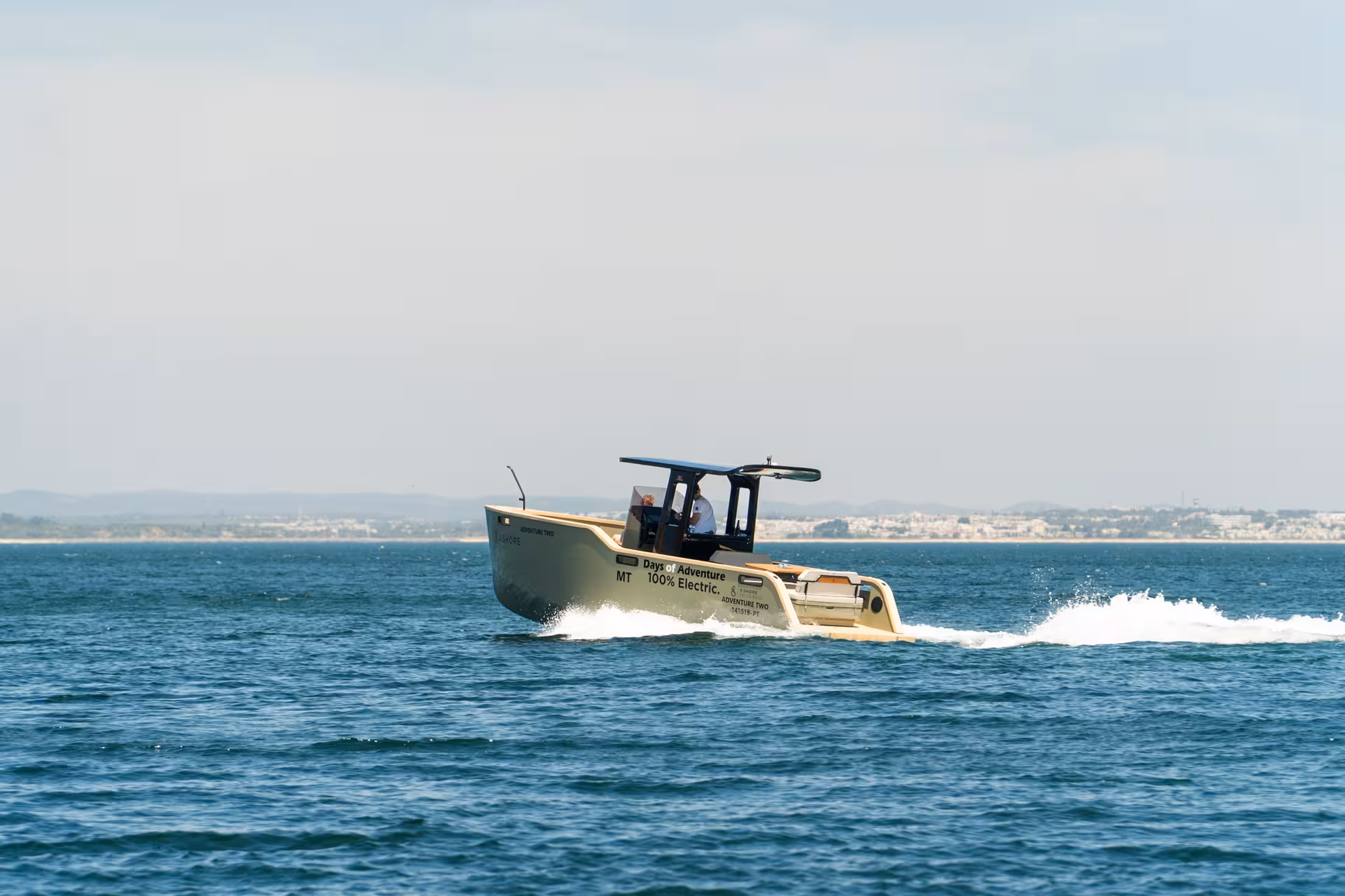 Days of Adventure 100% electric boat cruising blue Atlantic waters on a private Ponta da Piedade tour Lagos