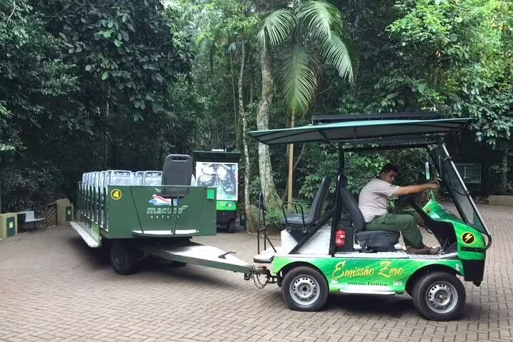 Eco-friendly electric vehicle preparing for a guided forest tour in Foz do Iguaçu, emphasizing sustainable tourism.