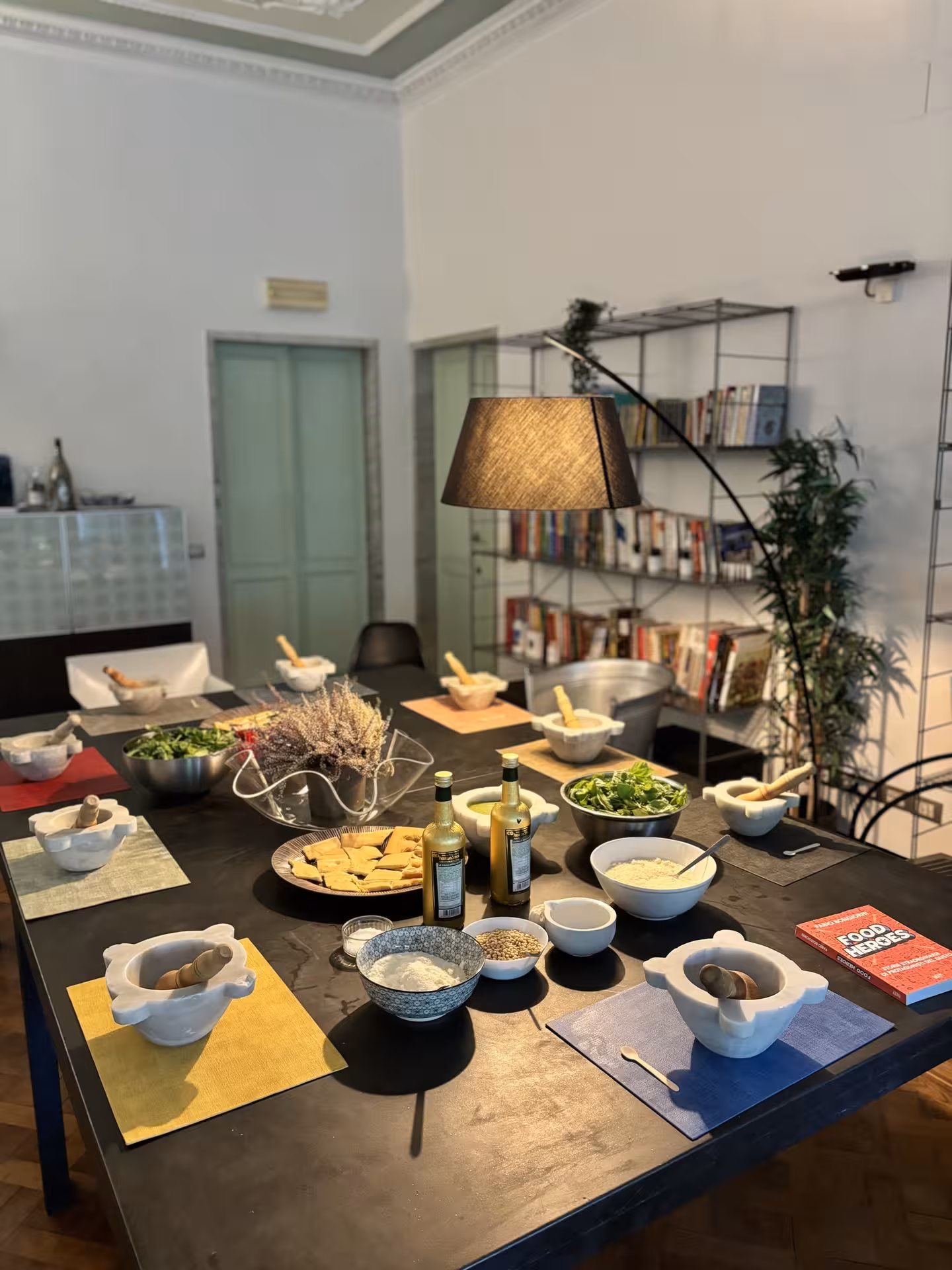 Elegant dining table set with gourmet ingredients for exclusive private dinner and show cooking experience.