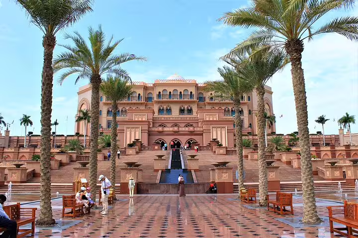 Emirates Palace Abu Dhabi entrance with palm-lined plaza on Dubai private day trip, luxury landmark stop