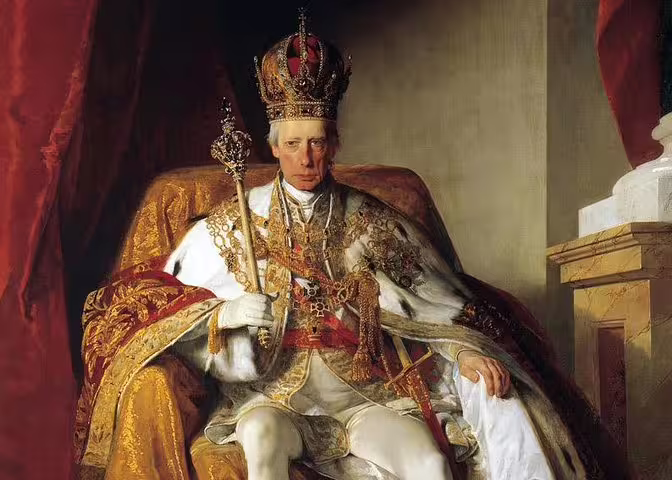 A regal portrait of an emperor wearing an ornate crown and robes, featured in the Imperial Treasury themed tour.