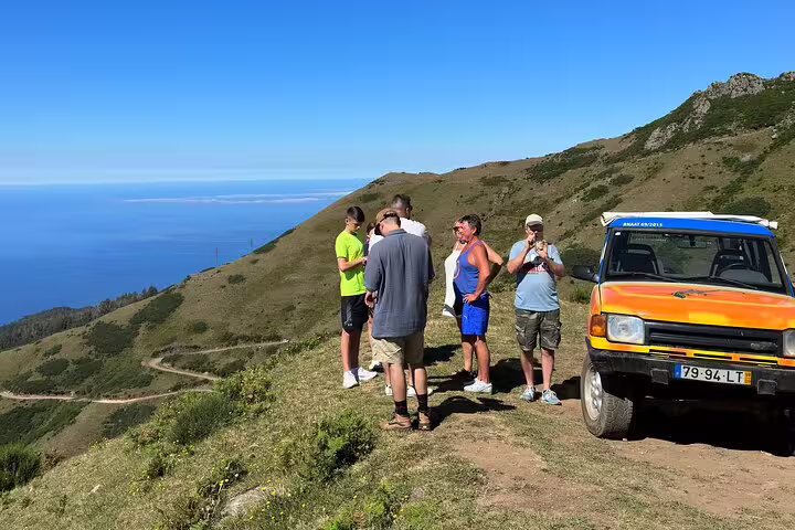 Tourists enjoy a thrilling 4x4 adventure through lush vineyards and rugged trails on the Enchanted Vineyards tour in Cabo Girão.