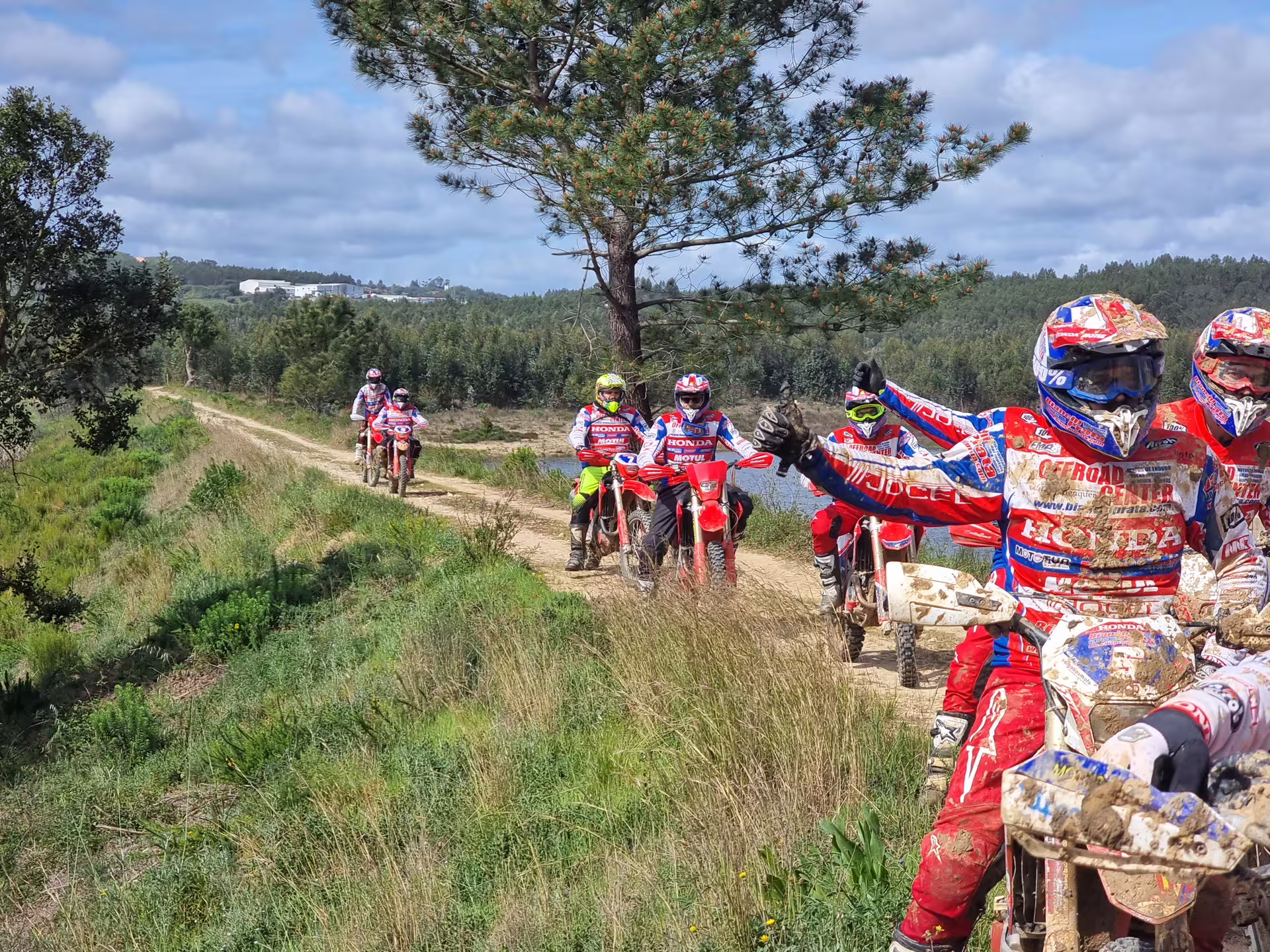 Enduro riders navigating scenic forest trails in Carregado, Lisbon, during a thrilling 3-hour dirt bike adventure.