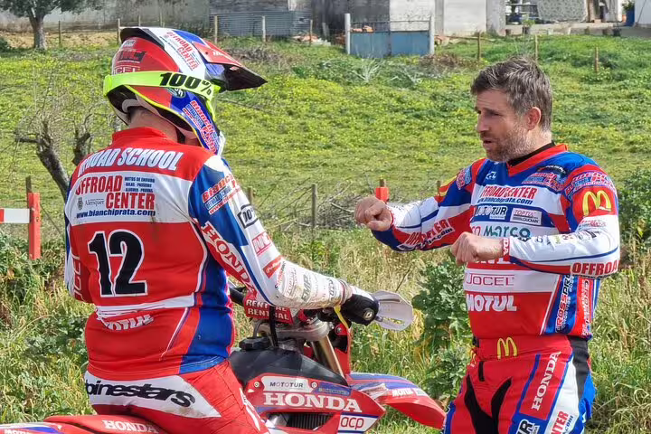 Enduro instructor gives guidance to a rider during the 3-hour Enduro Stage in Carregado, enhancing skills and safety.