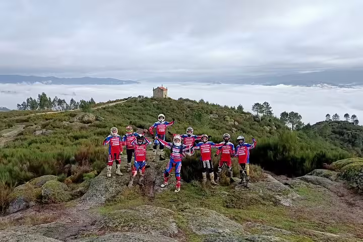 Group of enduro riders pose on a scenic hilltop during a thrilling 3-hour motorbike tour in Marco de Canaveses.