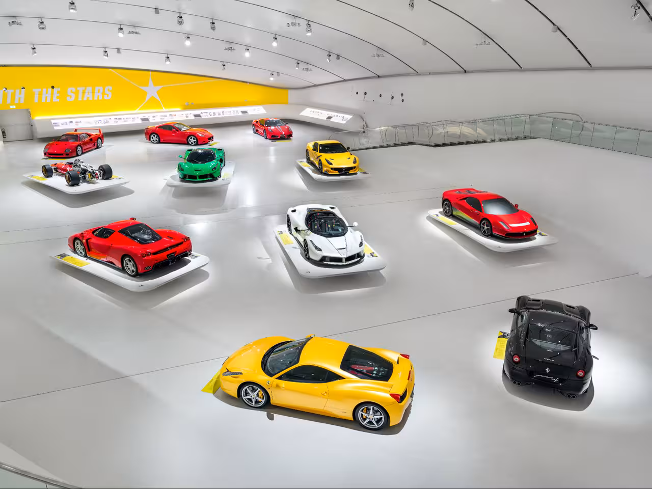 Wide view of Enzo Ferrari Museum Modena supercar hall, must-see stop on Ducati Museum and Ferrari combo visit