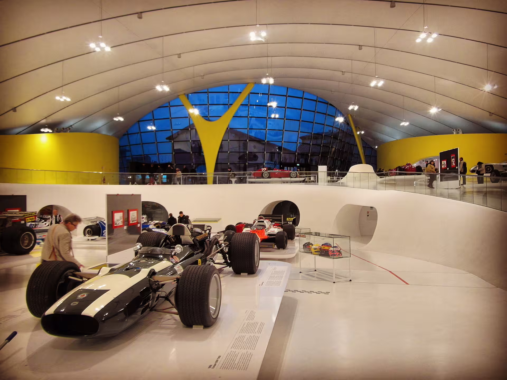 Racing cars on display inside Enzo Ferrari Museum Modena, included in bus transfer tour to Maranello