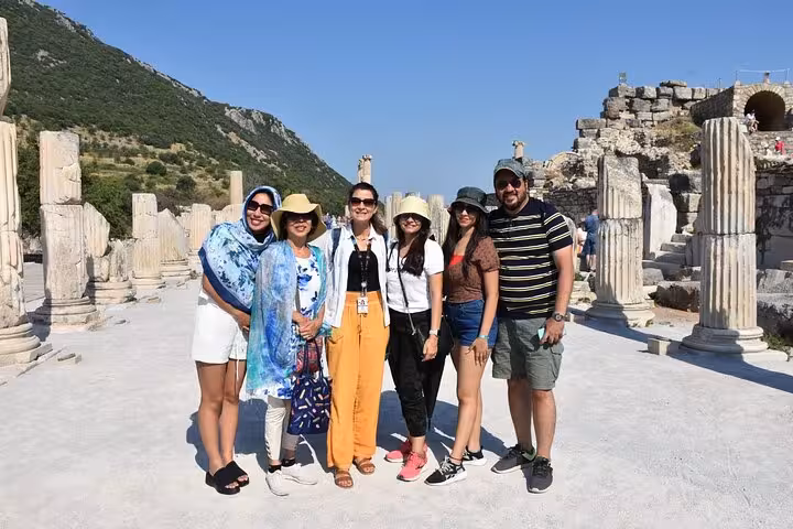 Small group at Ephesus ancient city on day trip from Istanbul by plane, walking among marble columns