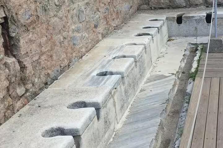 Ephesus ancient public latrines ruins on private Ephesus tour with St. John Basilica, House of Mary and lunch included
