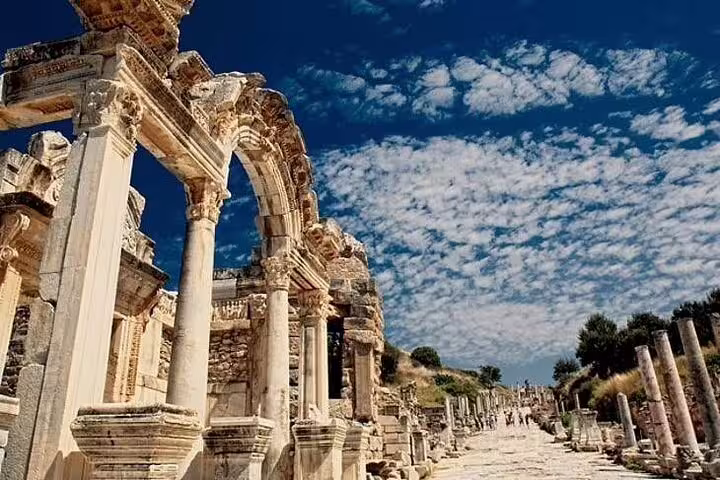Scenic view of ancient ruins under a blue sky along the Ephesus pathway, part of the skip-the-line tour.