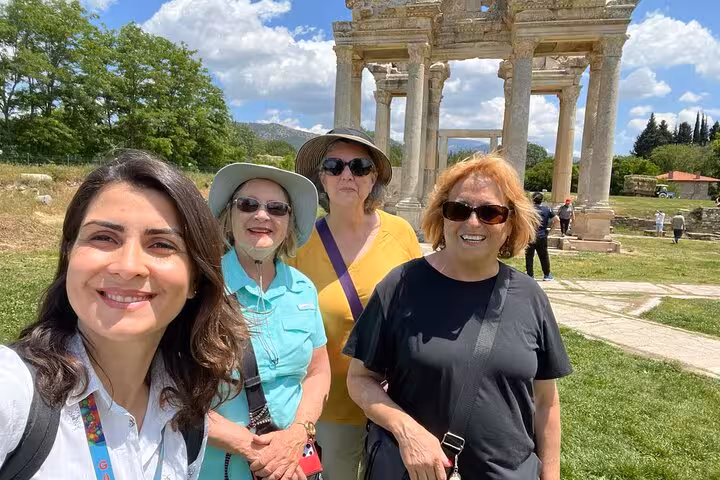 Group selfie at Aphrodisias Tetrapylon gateway on a 2 day Ephesus Aphrodisias and Pamukkale guided tour