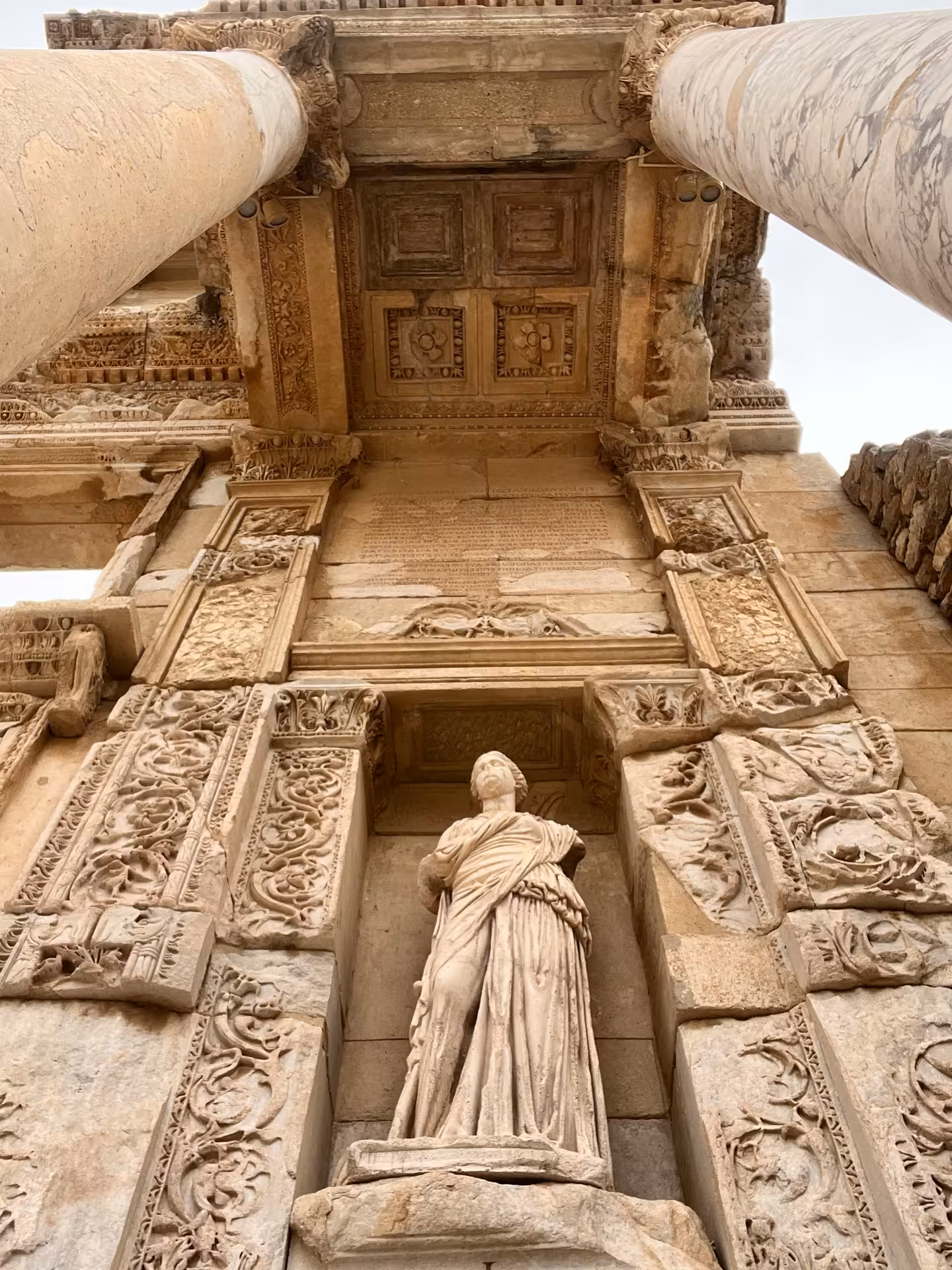 Carved statue and ornate stonework at Ephesus ruins, must-see on Highlights of Turkey tour