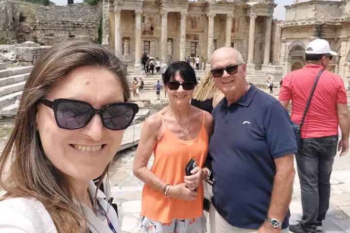 Cruise excursion guests selfie at Ephesus ruins near Library of Celsus on skip-the-line small group tour
