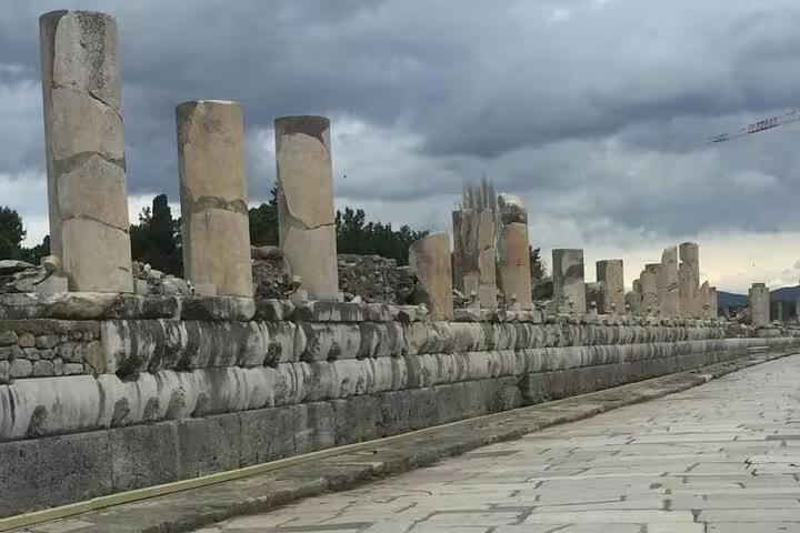 Ancient marble columns along Curetes Street in Ephesus ruins, part of private guided tour with lunch from Kusadasi