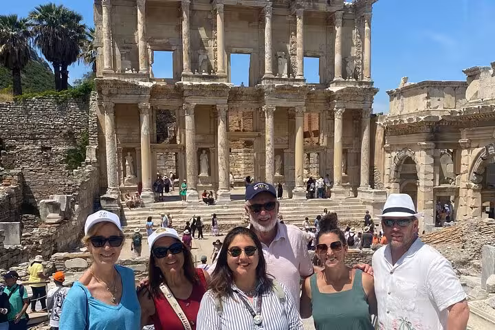 Cruise guests pose at the Library of Celsus on an Ephesus private tour from Izmir Cruise Port, Turkey