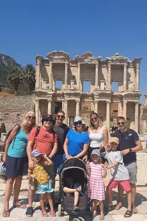 Small group photo at Ephesus Library of Celsus ruins, family tour including House of Mary and lunch