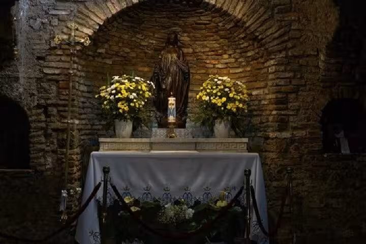 Stone chapel altar with religious statue and flowers, spiritual stop on 5 Days Ephesus Pamukkale Cappadocia Tour