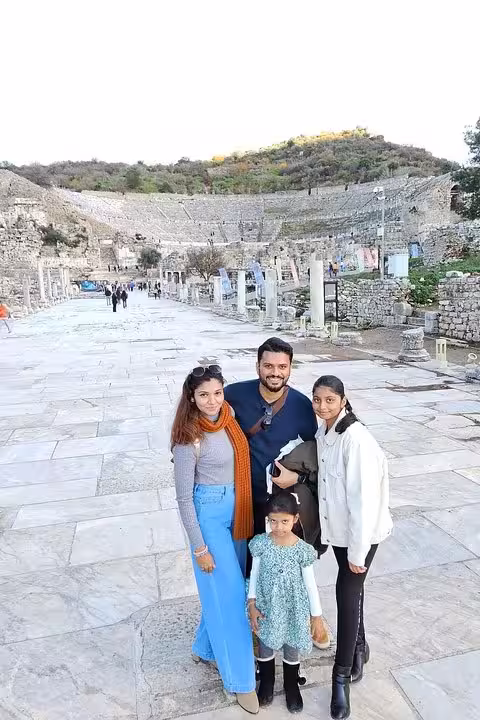 Family photo on Curetes Street in ancient Ephesus during private cruise shore excursion from Kusadasi