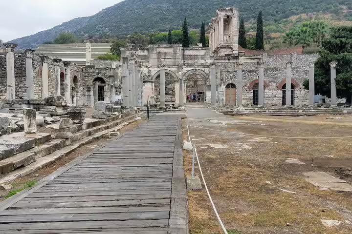 Ancient ruins and wooden walkway at Ephesus archaeological site, Turkey, on Seven Churches of Revelation tour