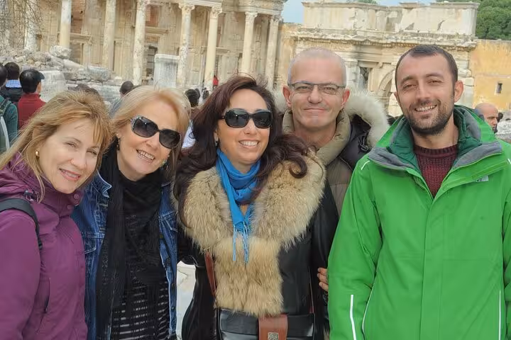 Guests on small group Ephesus shore excursion in Kusadasi with guide near ancient ruins