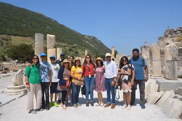 Small group poses among ancient columns at Ephesus on Kusadasi Cruise Port shore excursion with skip-the-line entry