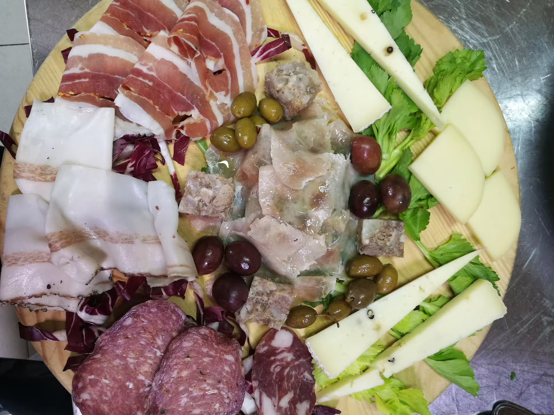 Sicilian lunch platter with local cheeses, salumi and olives included on Etna 4x4 Jeep tour from Taormina