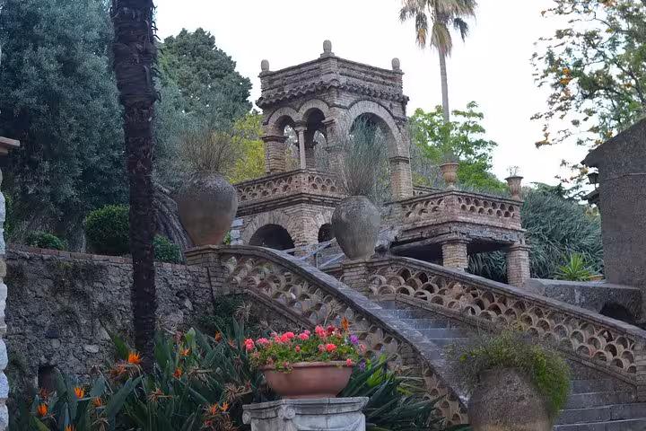 Explore the enchanting gardens and historic architecture of Taormina on the Etna and Taormina Tour.