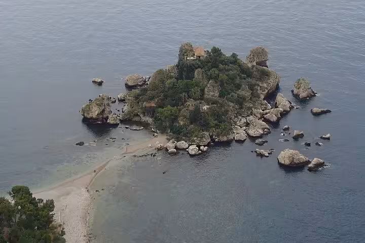 Discover Isola Bella's lush greenery and rocky shores on the Etna and Taormina Tour.