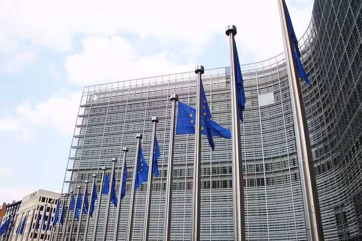 EU flags outside the European Commission in Brussels on a private half-day city sightseeing tour