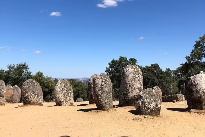 Explore the ancient Almendres Cromlech near Évora on a full-day tour from Lisbon, highlighting Portugal's prehistoric wonders.