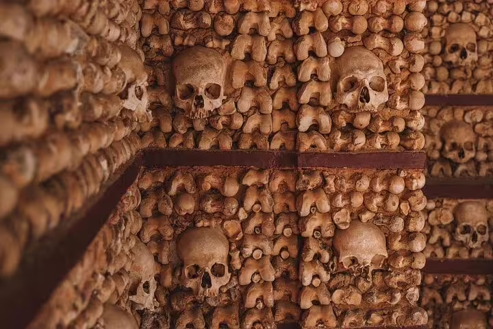 Chapel of Bones in Évora, adorned with human skulls and bones, highlights the historic charm of this full-day tour from Lisbon.
