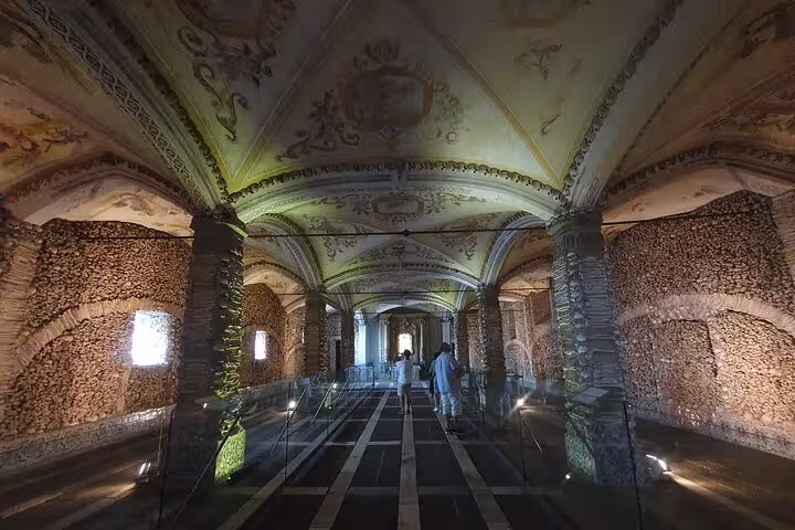 Explore the historic and eerie Capela dos Ossos in Évora on a captivating small-group tour from Lisbon to Monsaraz.