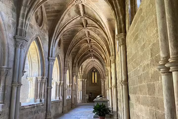 Explore the Gothic arches of a historic monastery in Évora on a private tour from Lisbon.