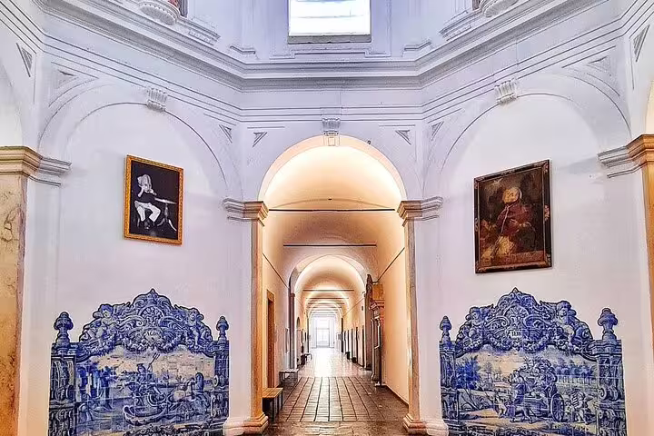 Elegant interior of a historic building with blue azulejos tiles in Évora, Portugal, featured in the full-day tour from Lisbon.