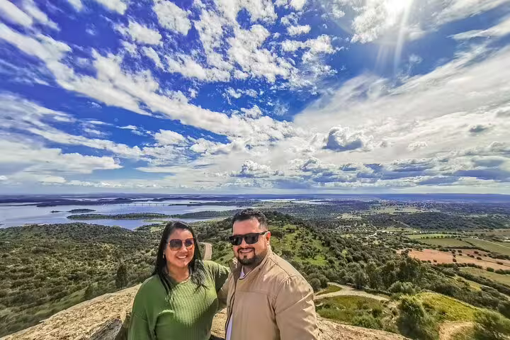 Couple enjoying stunning panoramic views of the Alentejo countryside on a day trip from Lisbon to Évora and Monsaraz.
