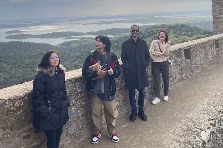 Tourists enjoy panoramic views of the Alentejo landscape during a private guided day tour to Évora and Monsaraz.