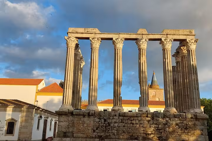 Ancient Roman Temple of Évora framed by historic buildings, a highlight on the Jewish History walking tour.